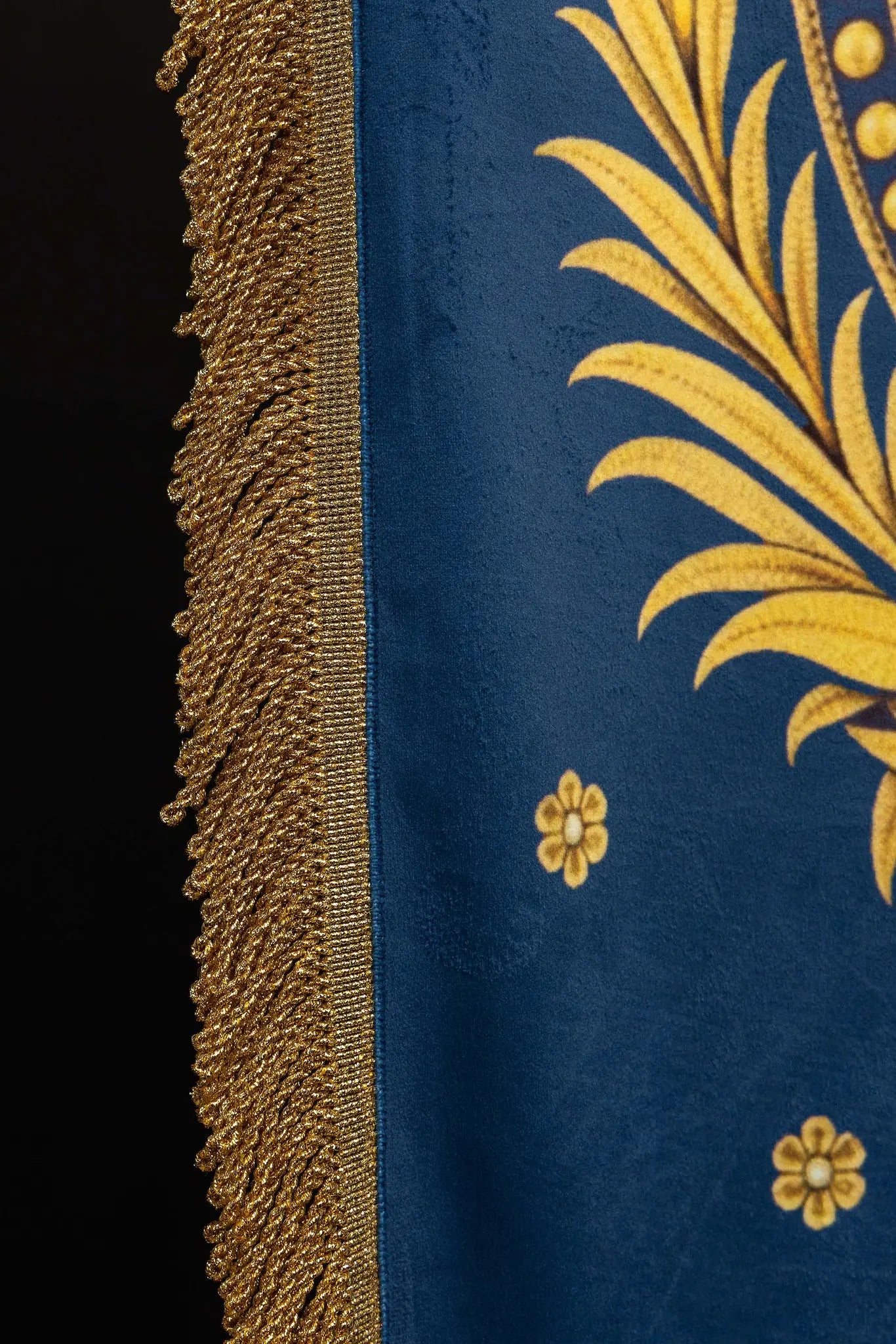 Double-sided processional banner with Our Lady of the Assumption on one side and a Marian monogram on the other, made of velour fabric with gold ornaments and fringes.