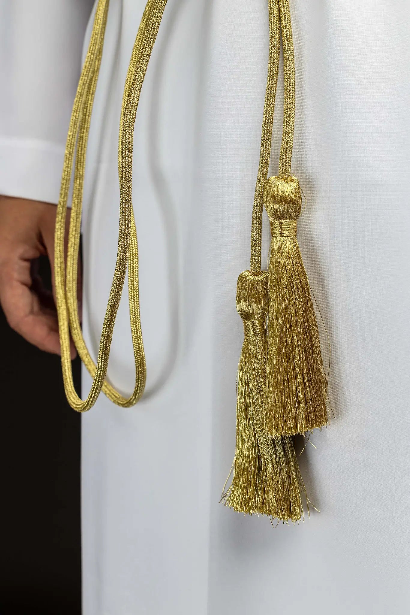 Gold liturgical cincture with decorative tassels made from braided cord