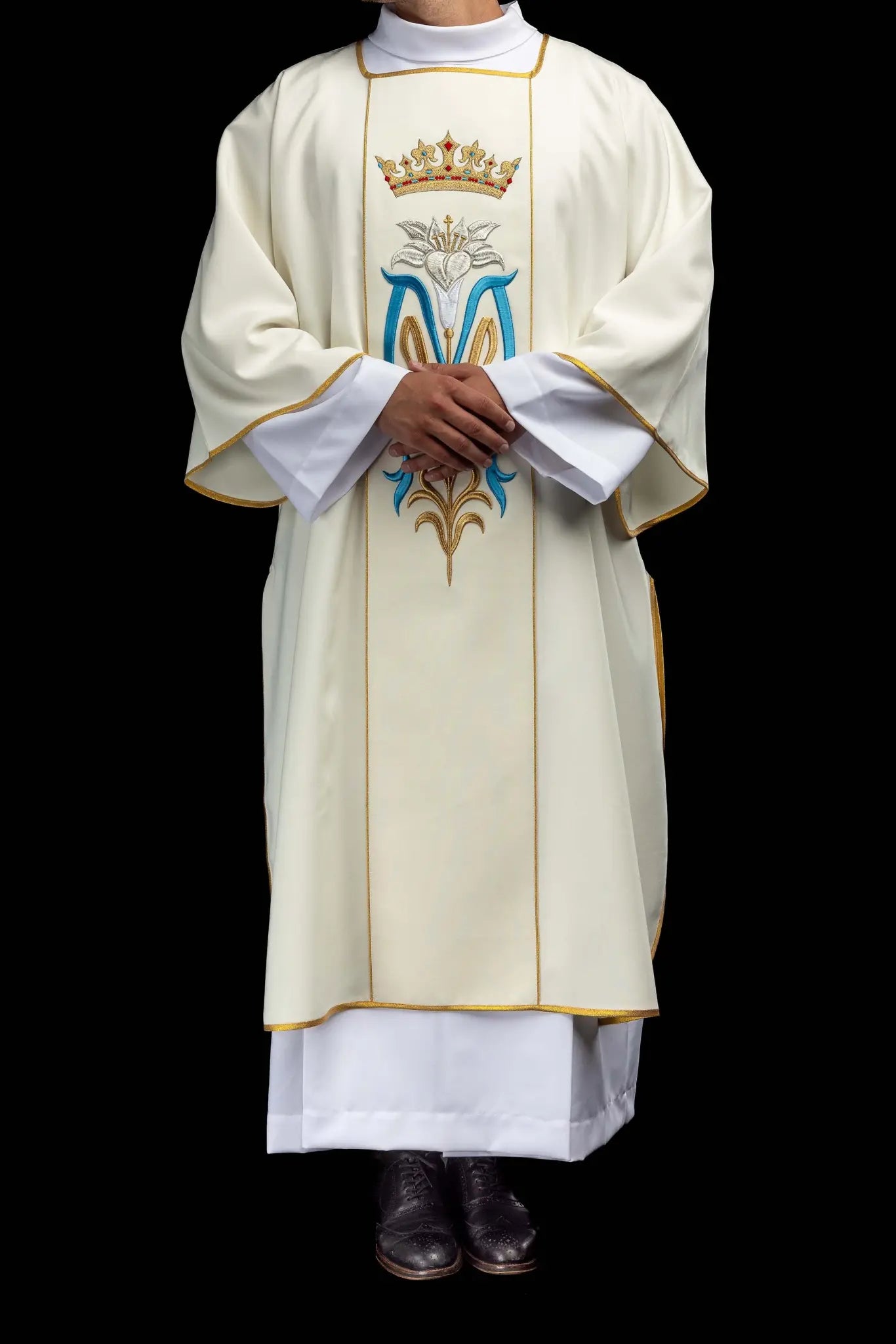 Ecru dalmatic with Marian embroidery, gold trim, and a matching stole.