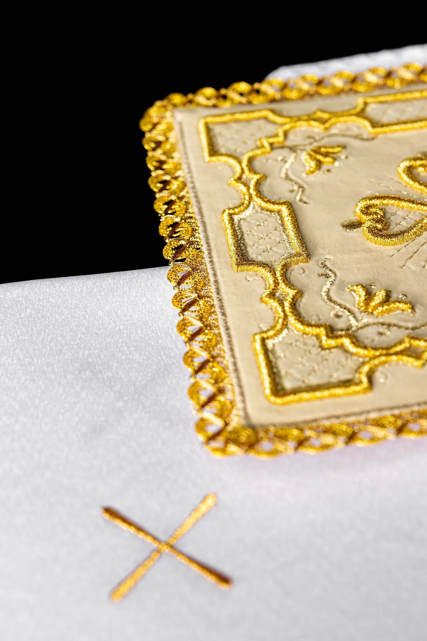 Ecru chalice linen set with velvet pall, corporal, purificator, and lavabo towel. The velvet pall features a central gold embroidered rosette cross with floral and geometric patterns and gold lace trim. The purificator and lavabo towel have a small gold embroidered cross and scalloped edges.
