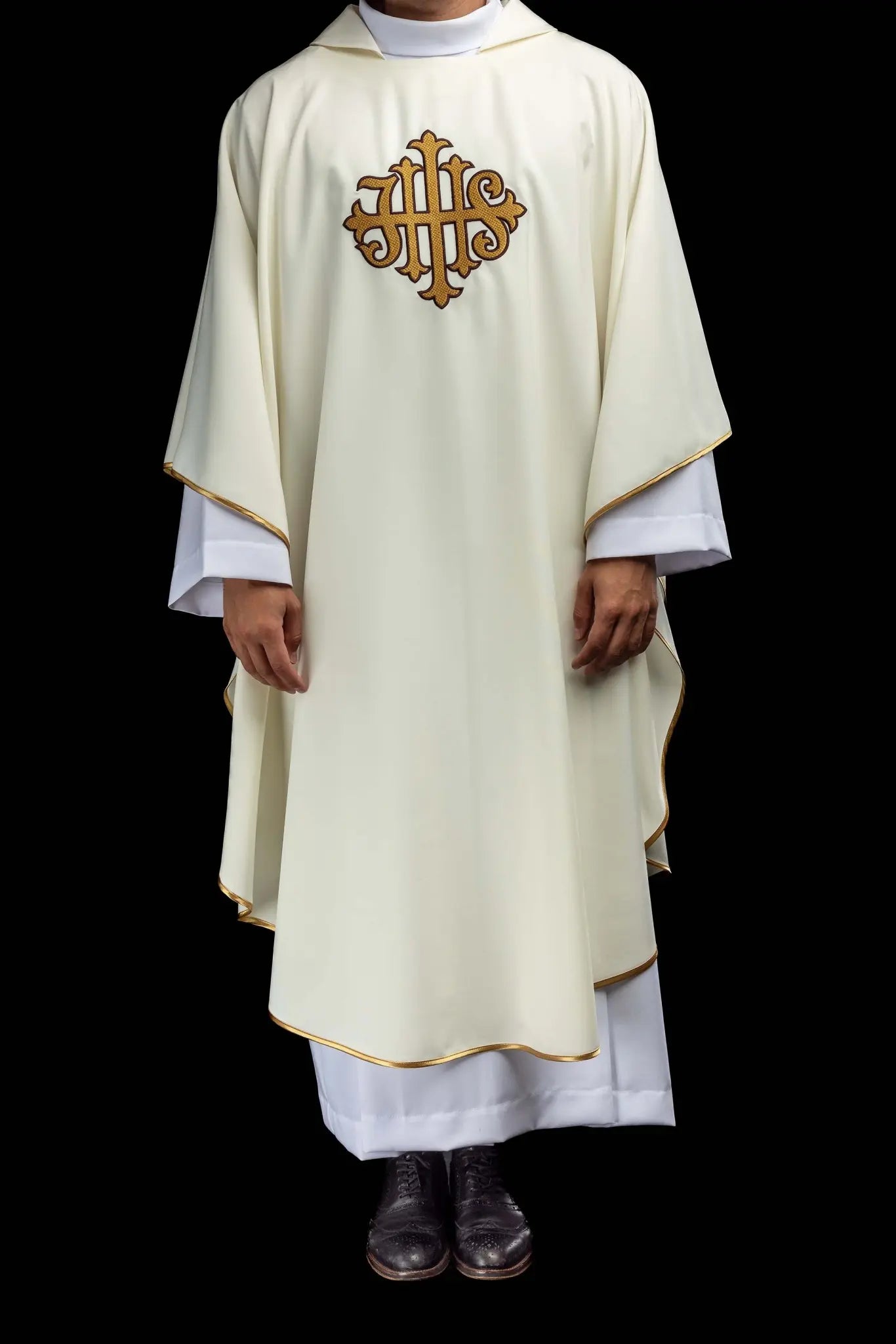 Ecru chasuble with gold IHS embroidery and gold trim, featuring a V-neck collar.