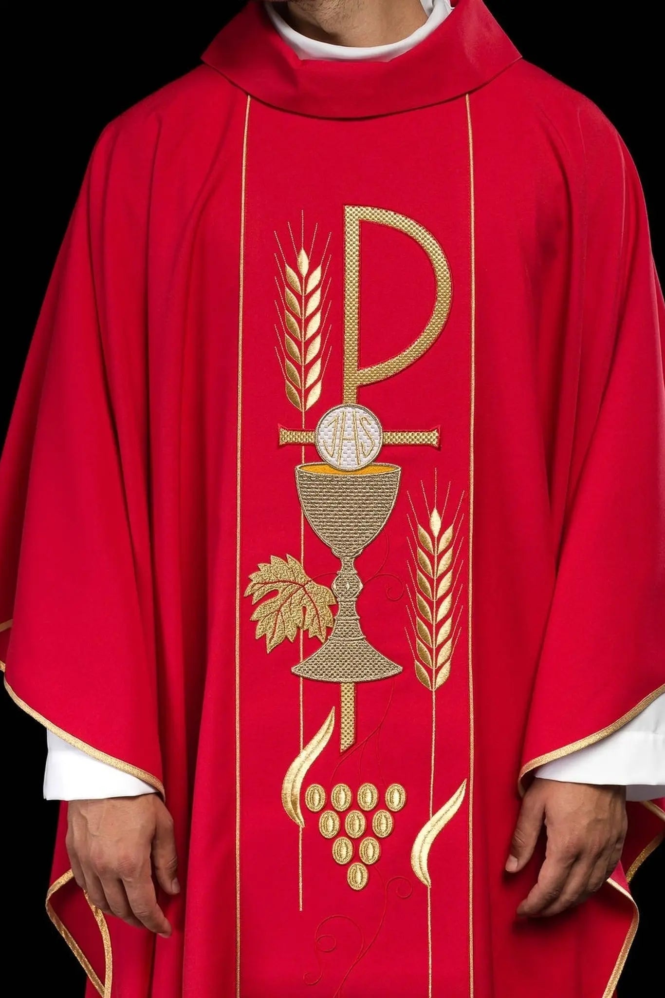 Red chasuble embroidered with IHS chalice design