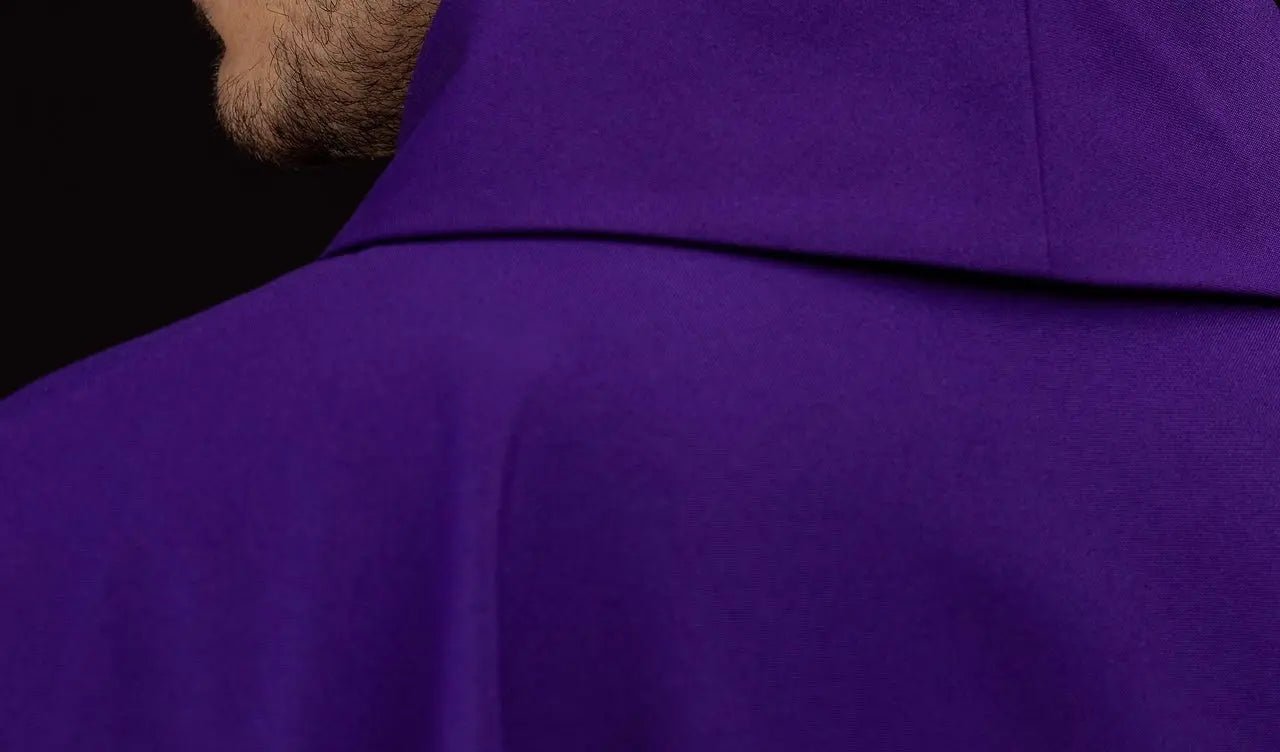 Purple chasuble embroidered with IHS motif