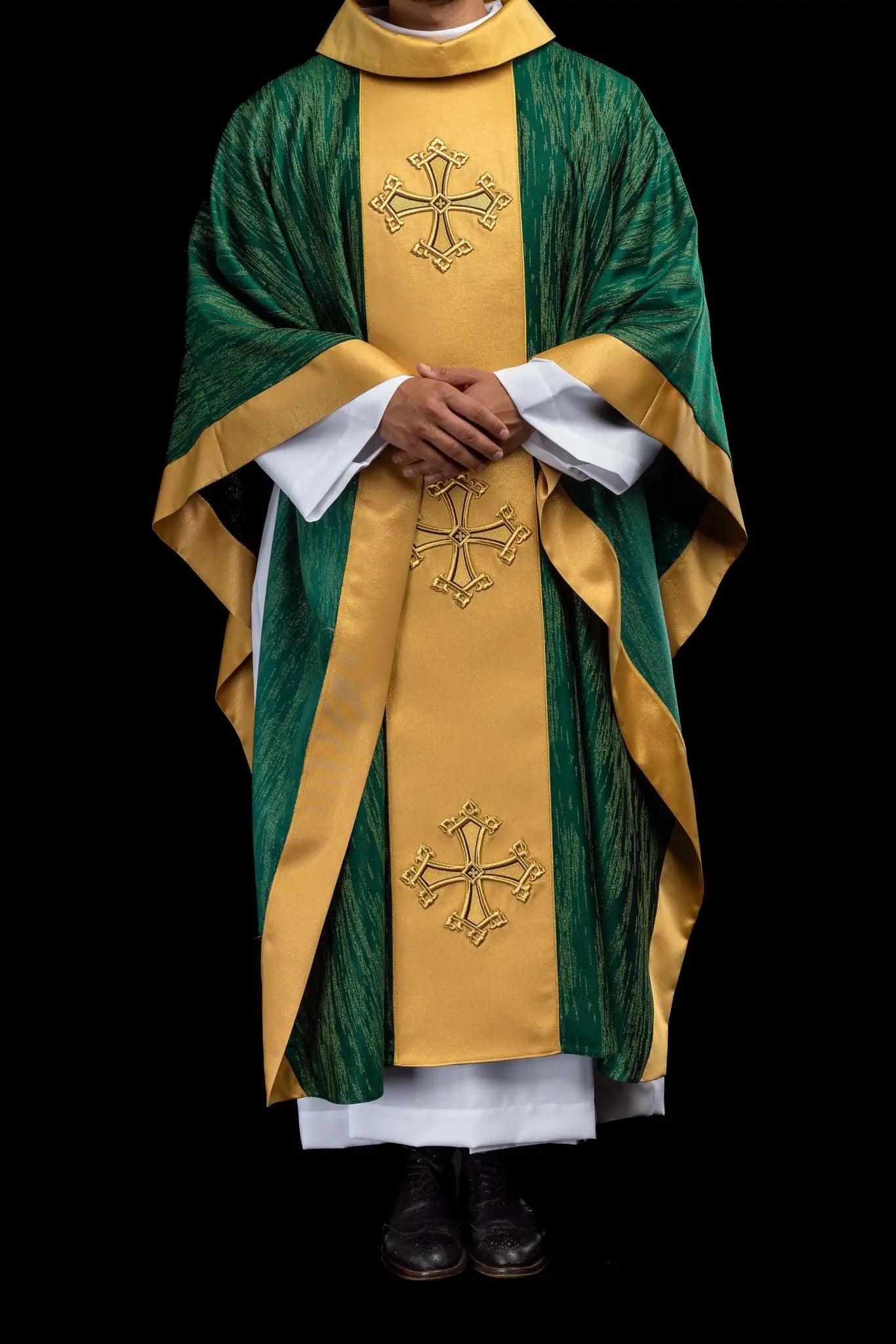 Green chasuble with a vertical gold band featuring embroidered crosses, gold trim on edges and collar, and a stand-up collar.