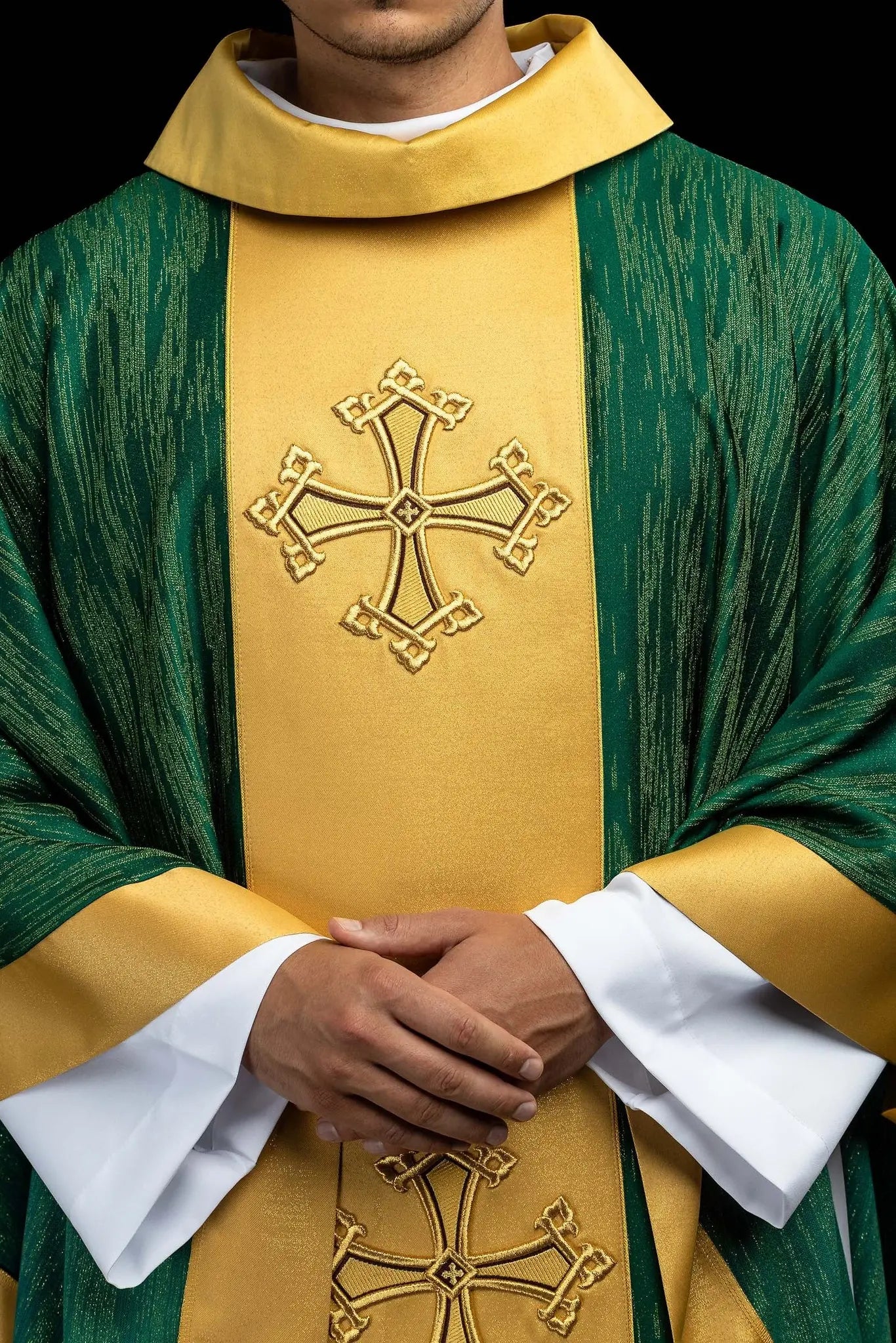 Green chasuble with a vertical gold band featuring embroidered crosses, gold trim on edges and collar, and a stand-up collar.