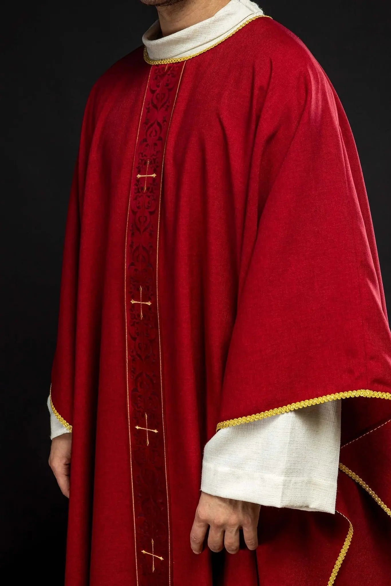 Red chasuble with an embroidered band of crosses