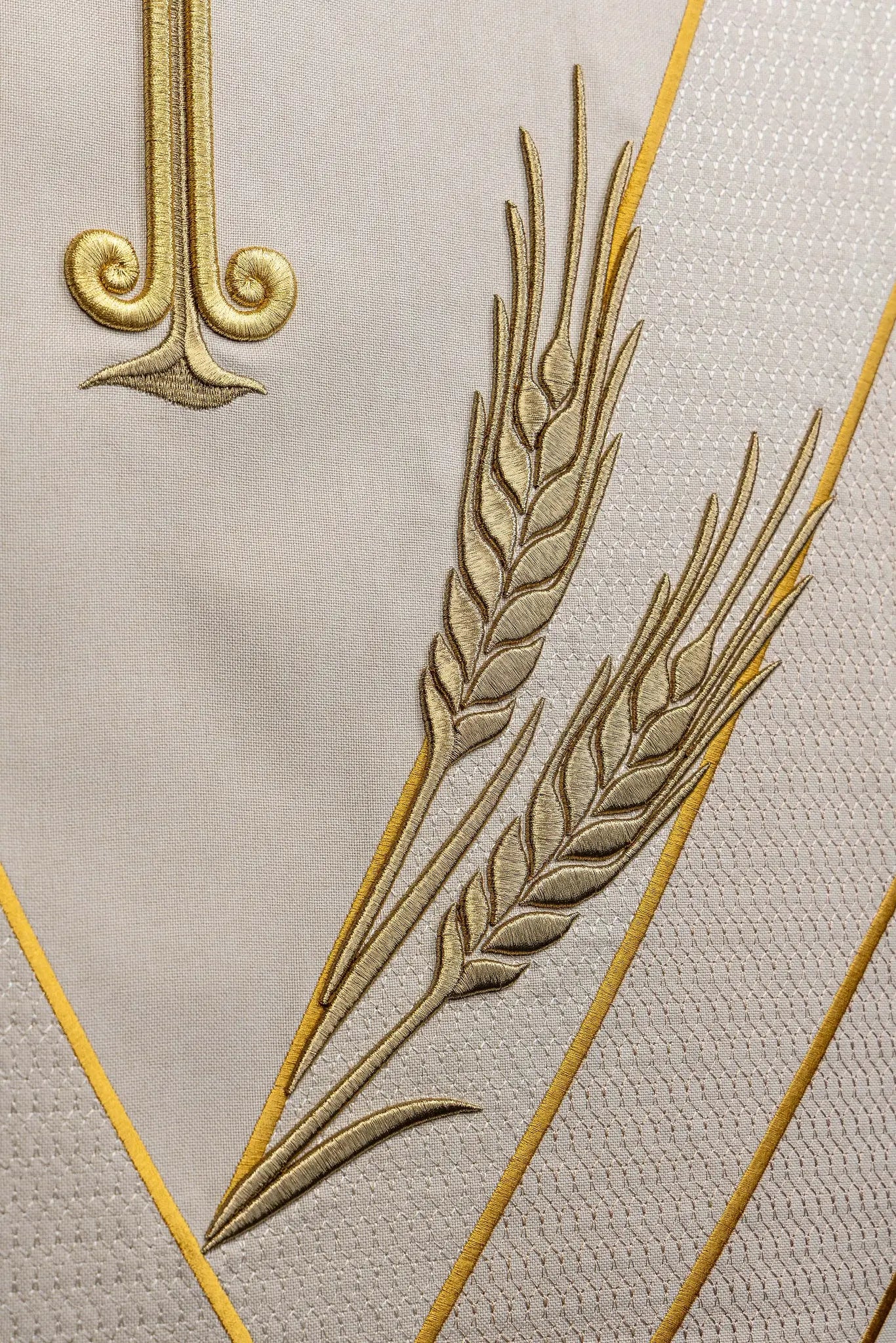 Ecru lectern cover with gold embroidered Chi-Rho symbol (cross with P) and wheat sheaves, suitable for liturgical use.