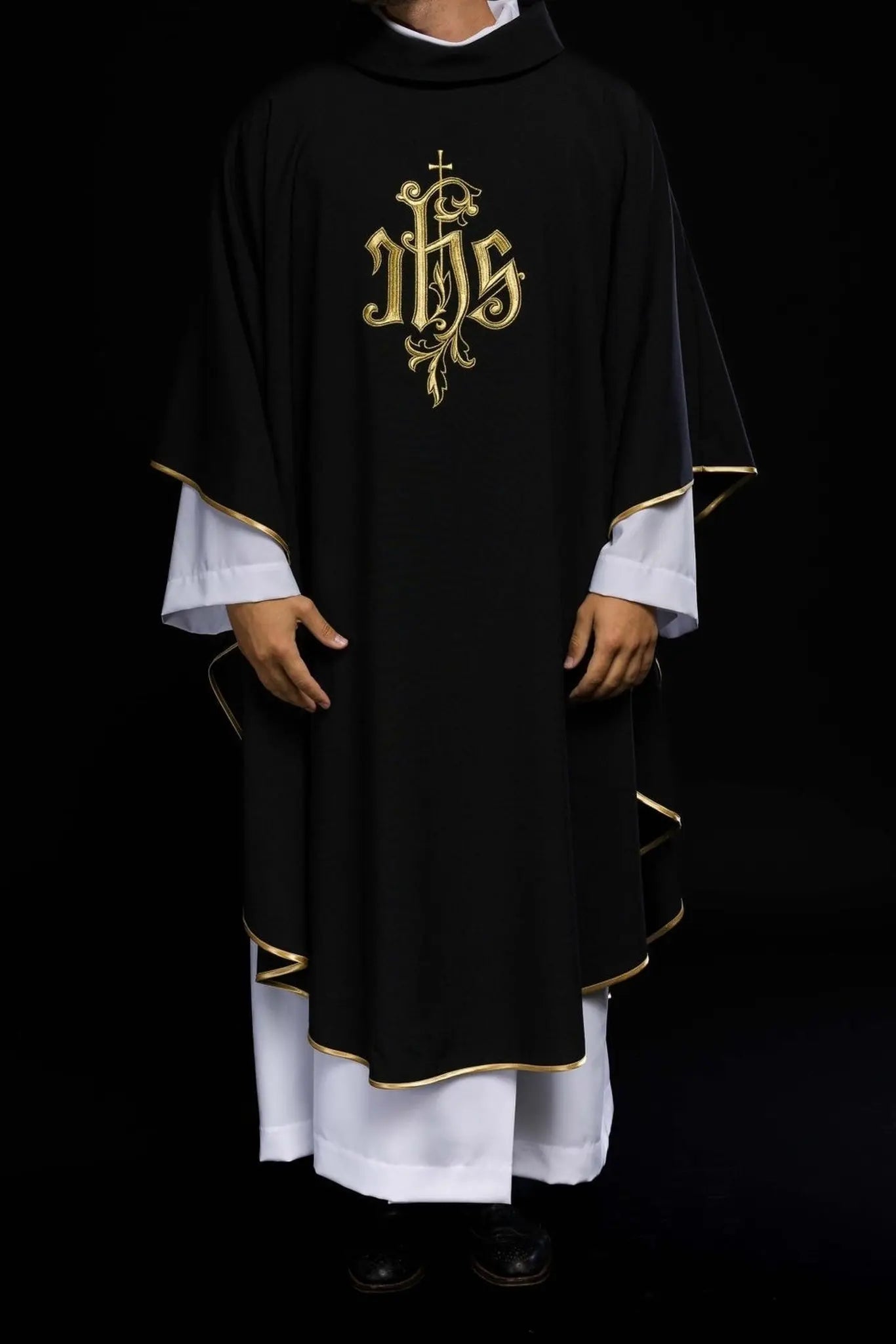 Black chasuble embroidered with IHS