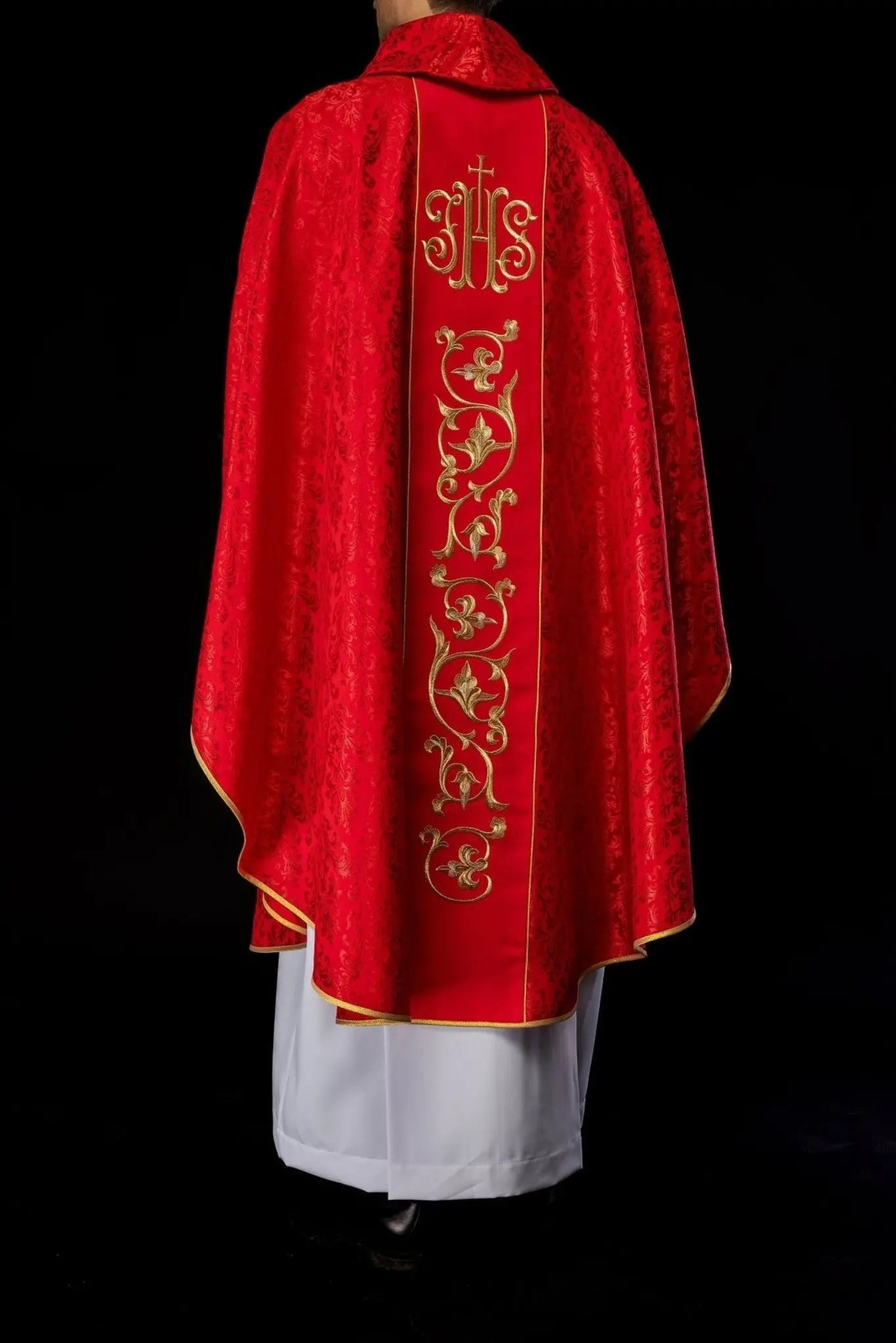 Red liturgical chasuble with richly decorated IHS belt