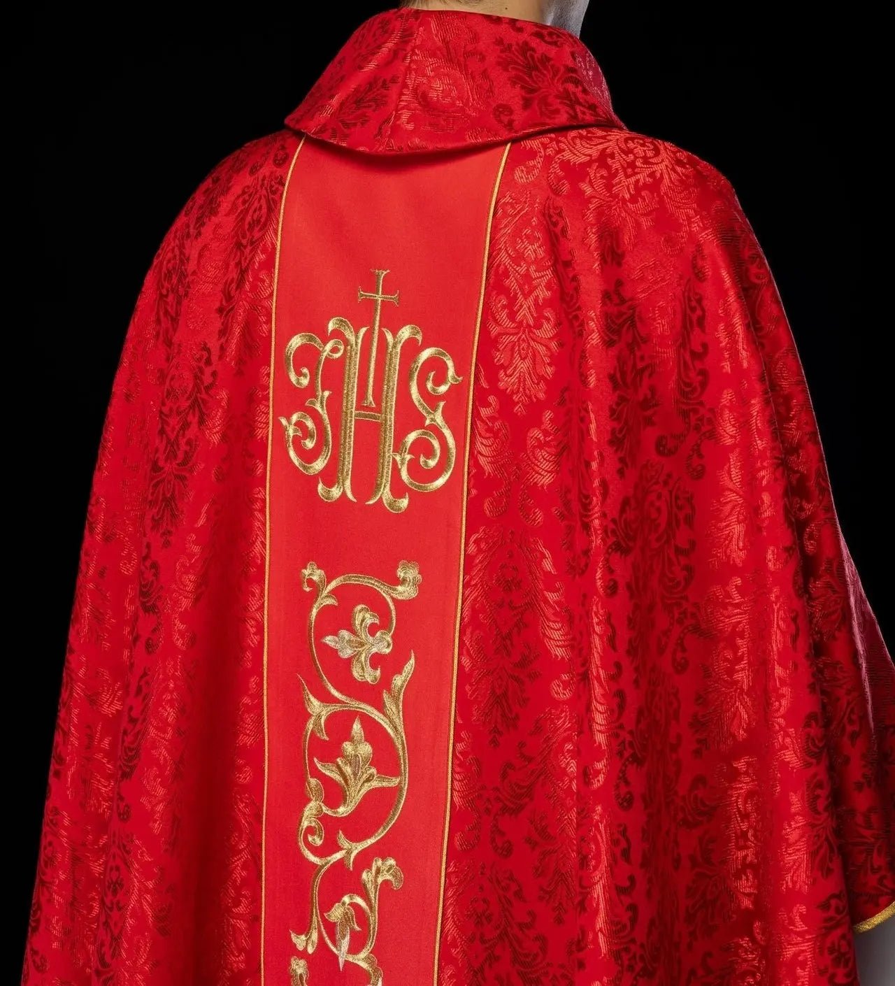 Red liturgical chasuble with richly decorated IHS belt