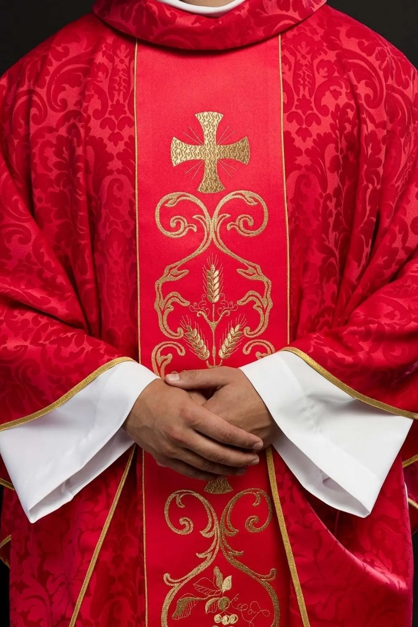 Red liturgical chasuble decorated with embroidered belt