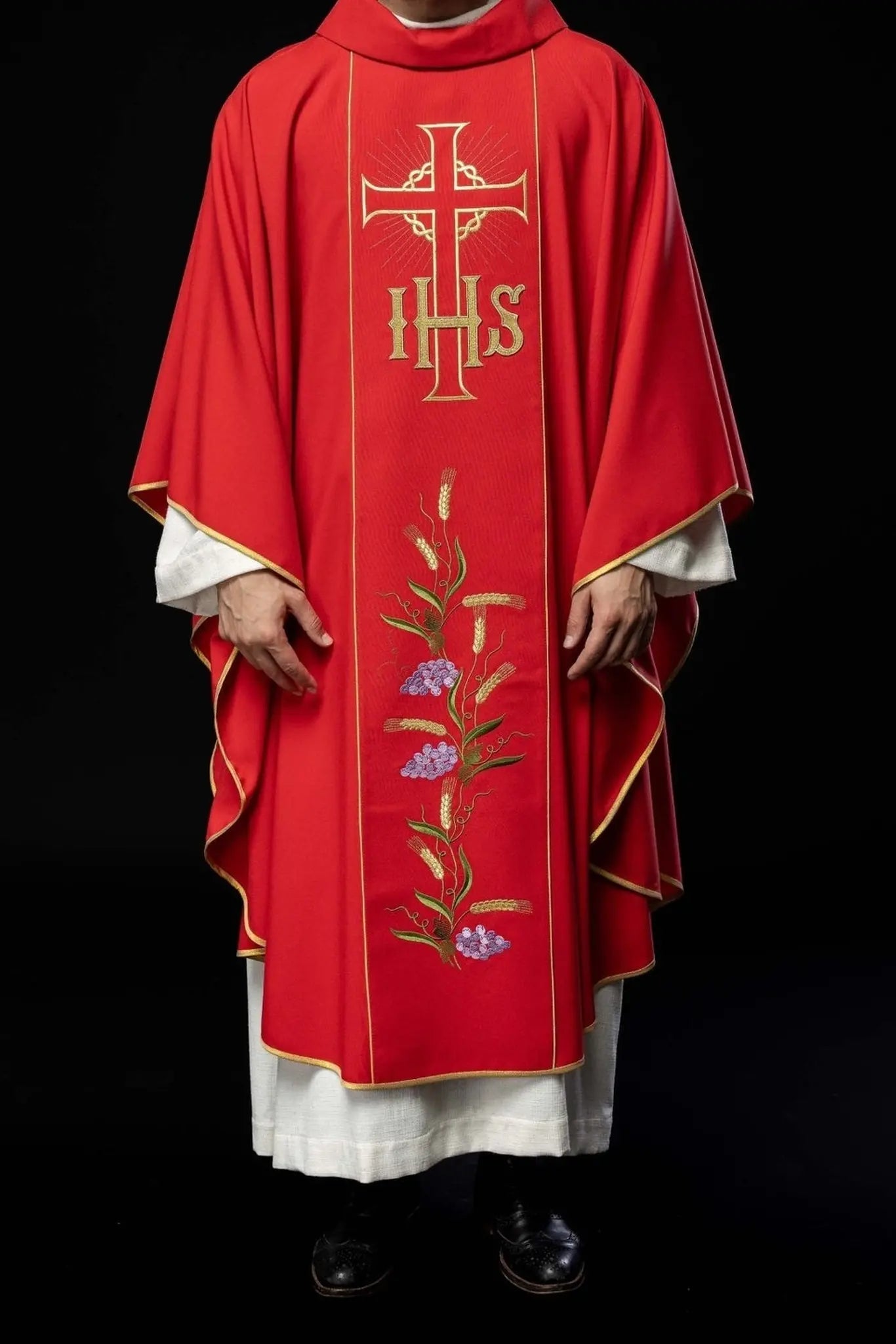 Red chasuble with decorated gold belt with IHS and ears