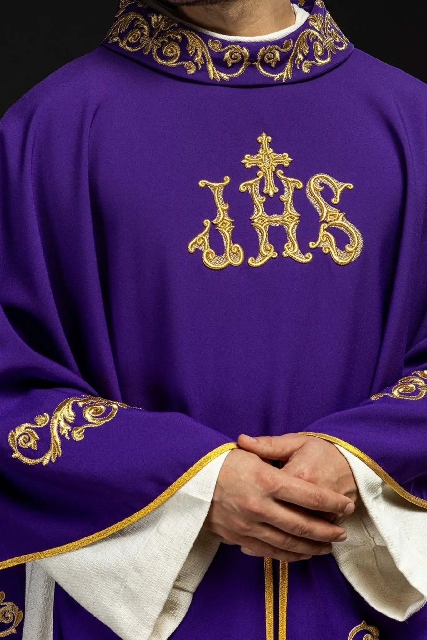 Purple chasuble with gold IHS embroidery and decorative trim