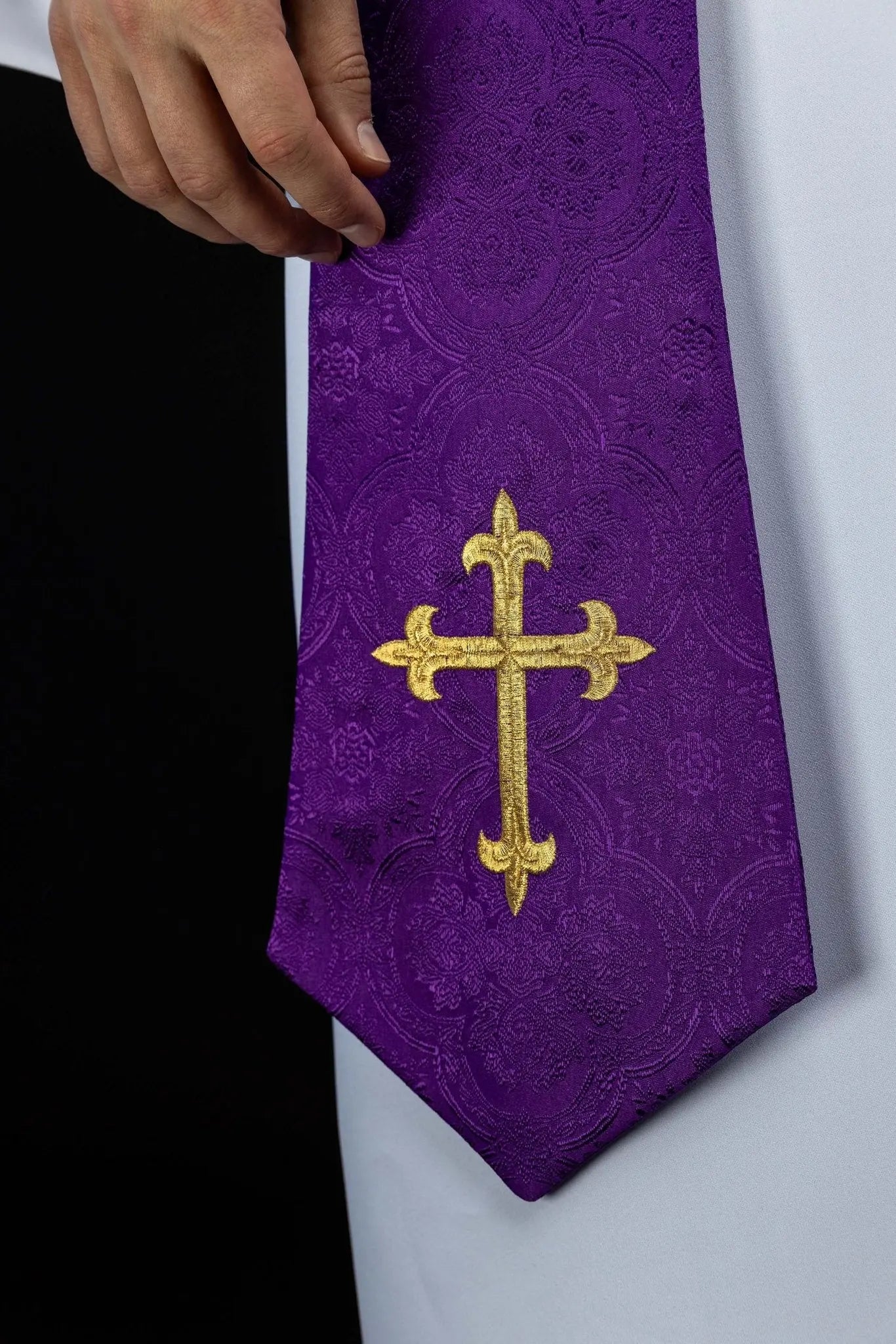 Purple jacquard stole with embroidered cross motif