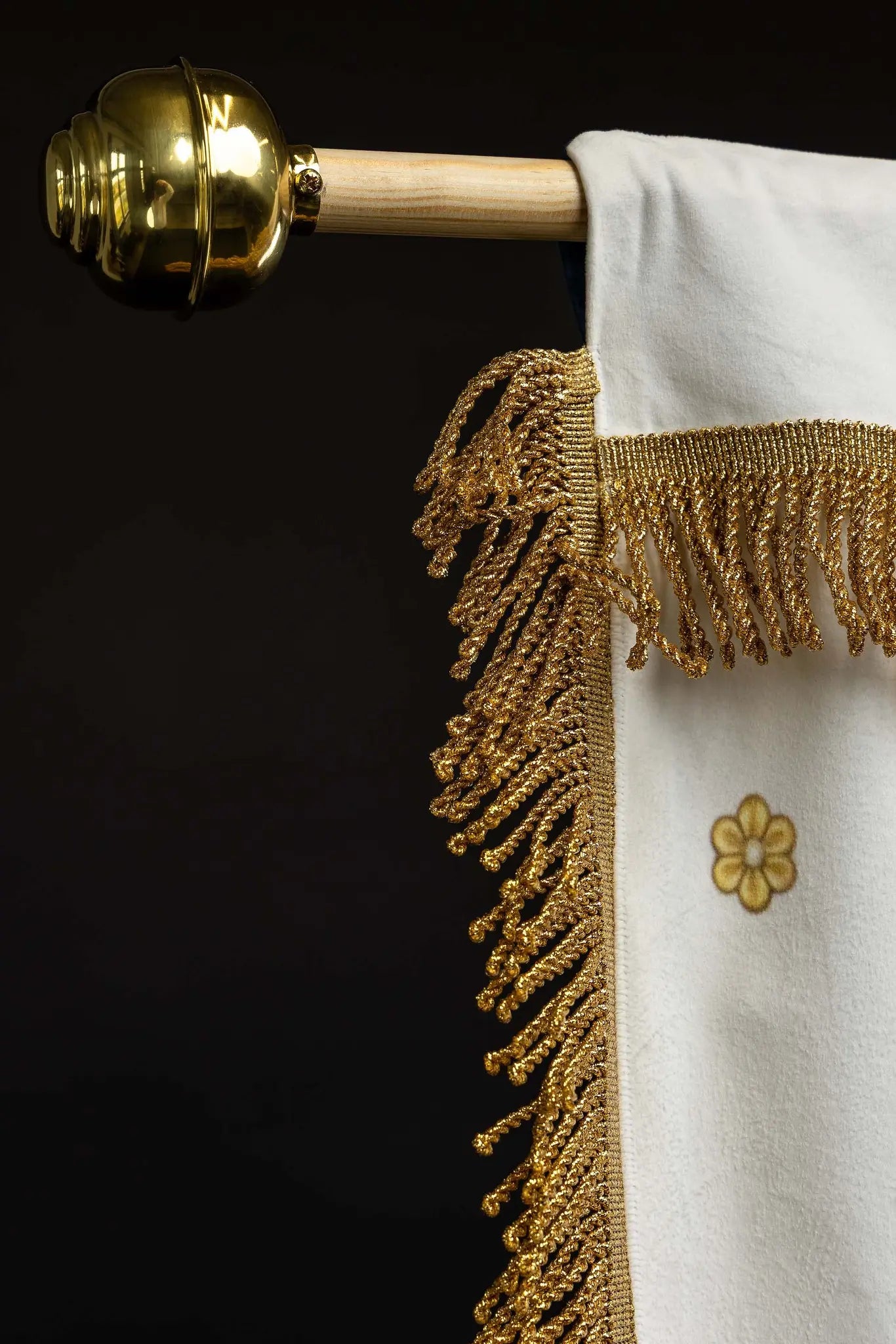 Double-sided processional banner with Our Lady of the Assumption on one side and a Marian monogram on the other, made of velour fabric with gold ornaments and fringes.