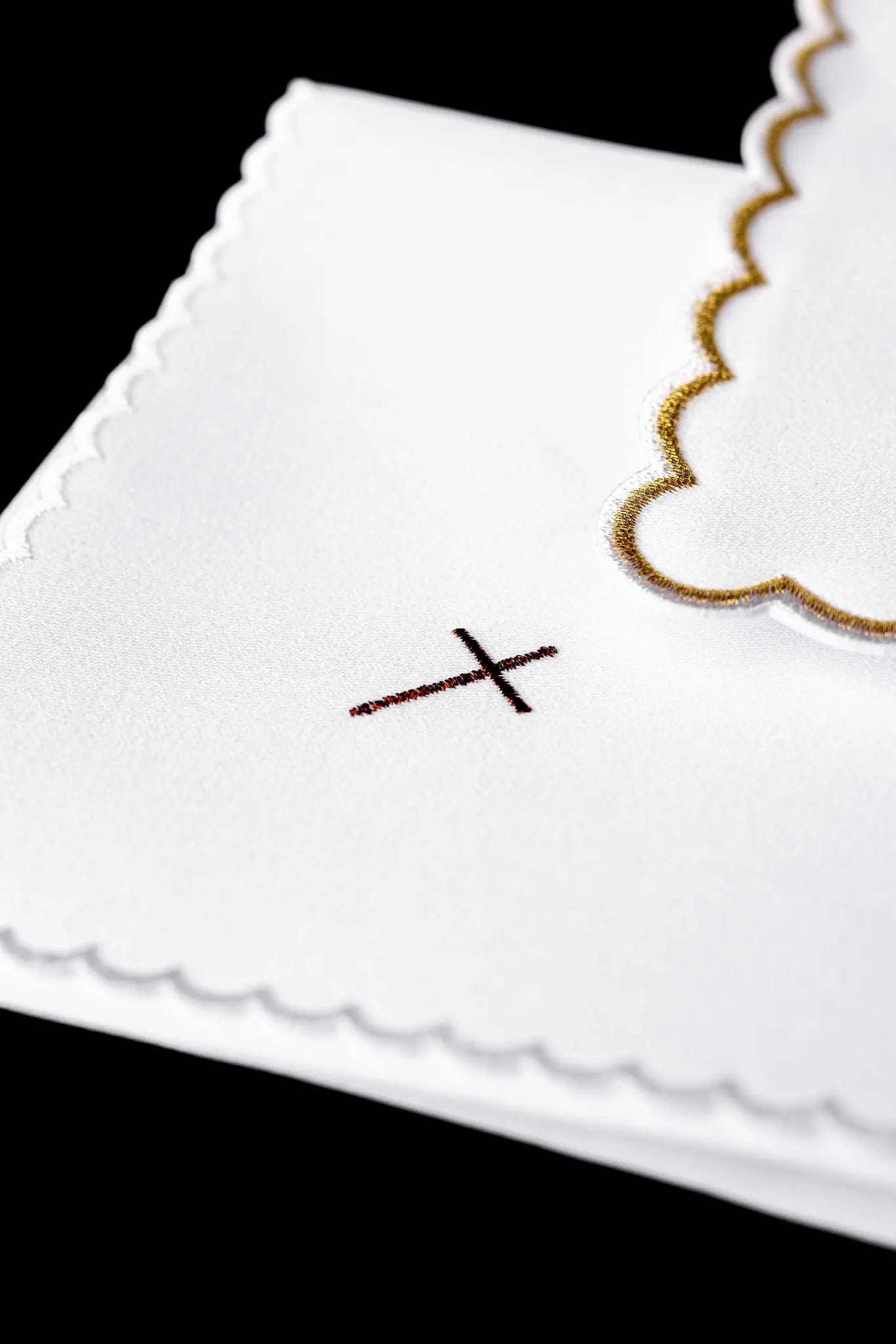 White chalice linen set with IHS monogram embroidery on the pall and cross embroidery on the purificator and lavabo towel.