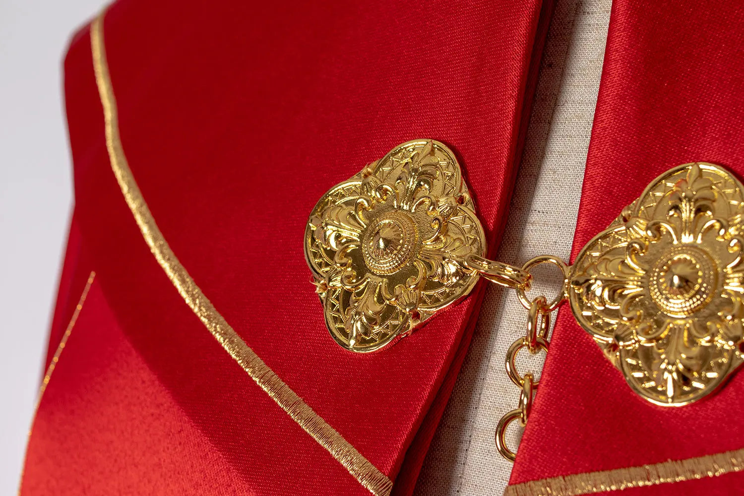 Red liturgical cape with gold monogram
