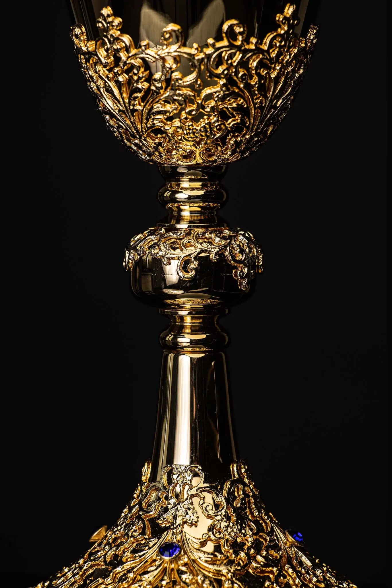 Handmade gold-plated chalice with floral ornamentation on the cup, knop, and base, adorned with blue imitation sapphires.