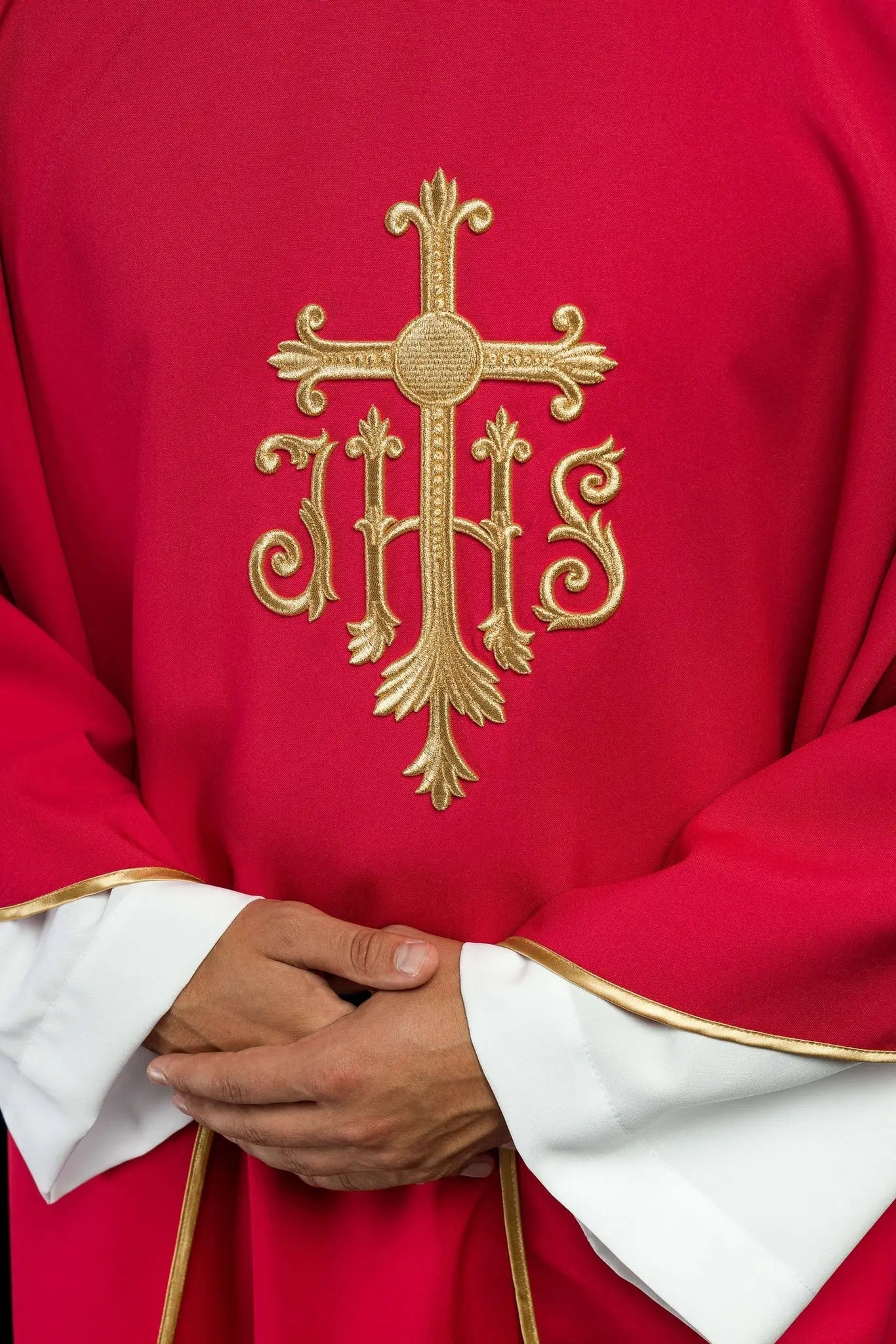 Embroidered red chasuble with JHS symbol