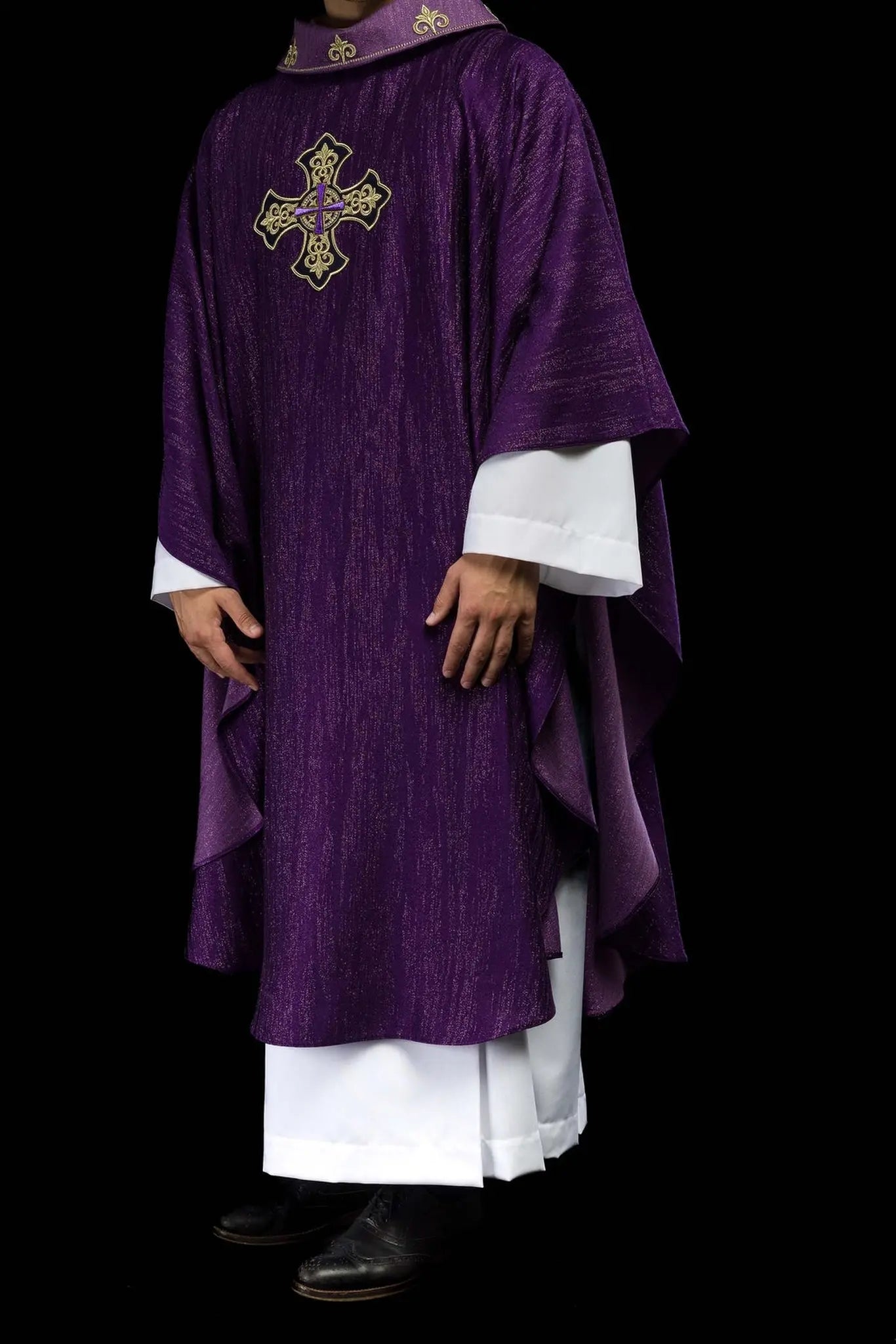 Purple chasuble with embroidered cross motif on decorative fabric