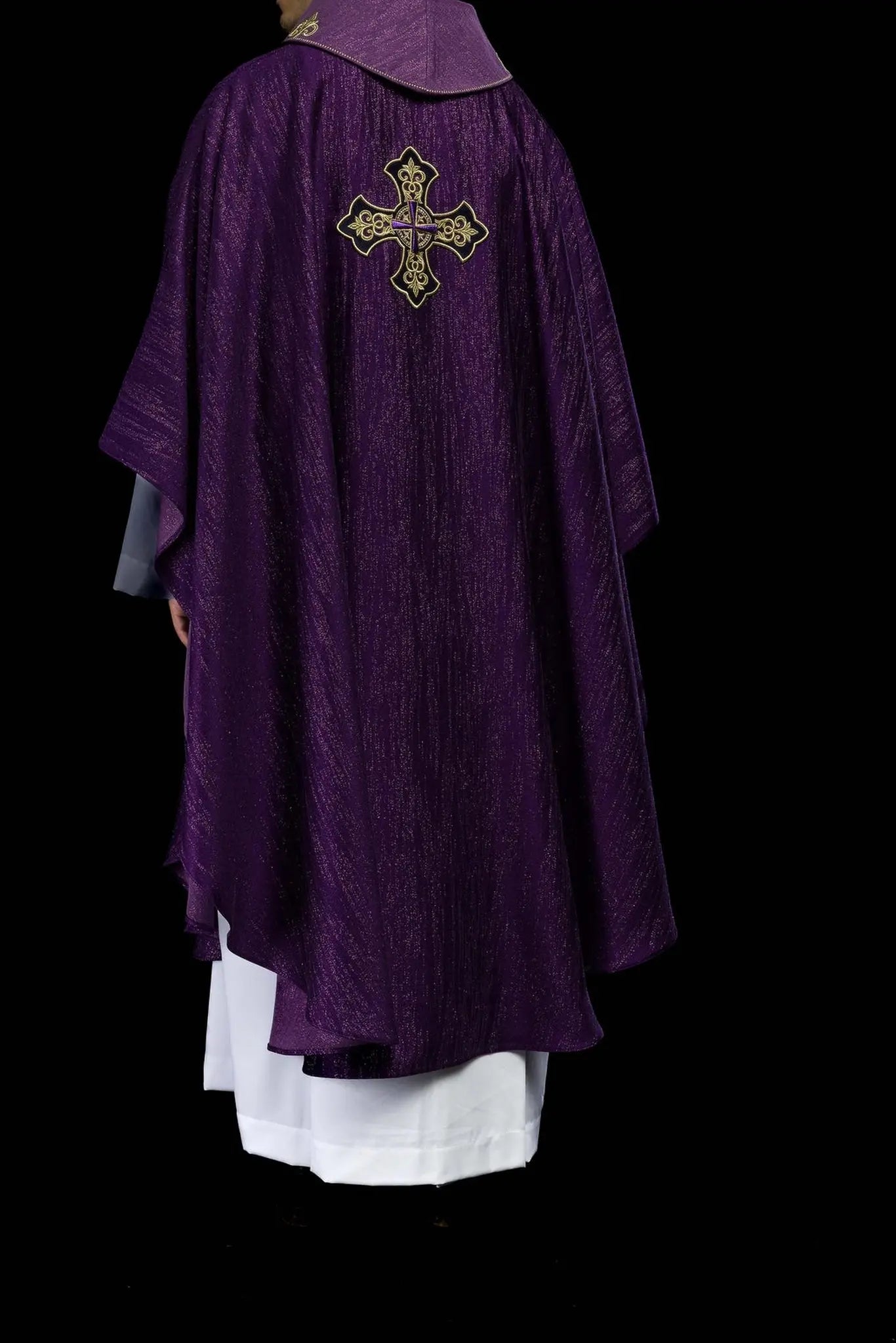 Purple chasuble with embroidered cross motif on decorative fabric