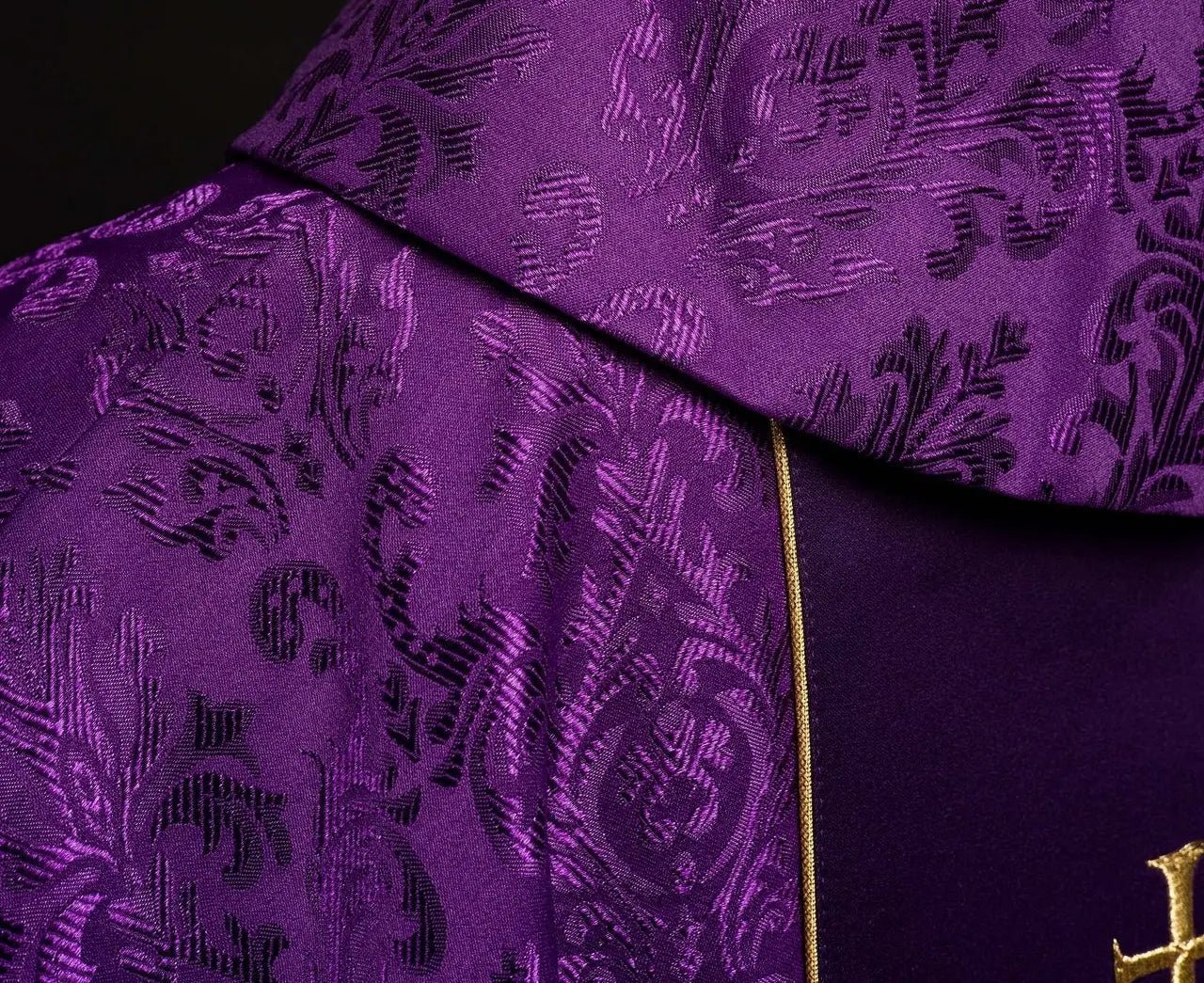 Purple liturgical chasuble with richly decorated IHS belt
