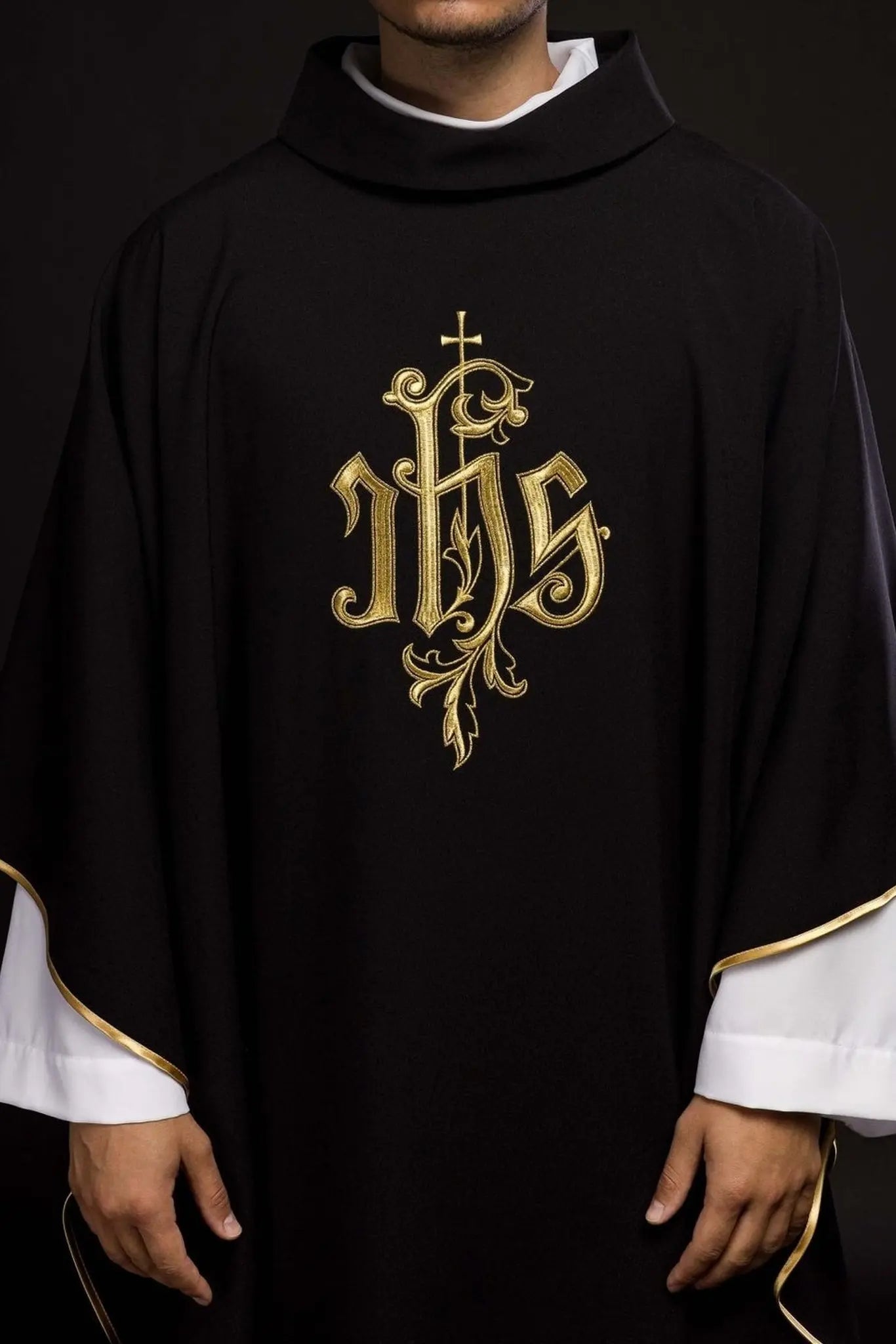 Black chasuble embroidered with IHS
