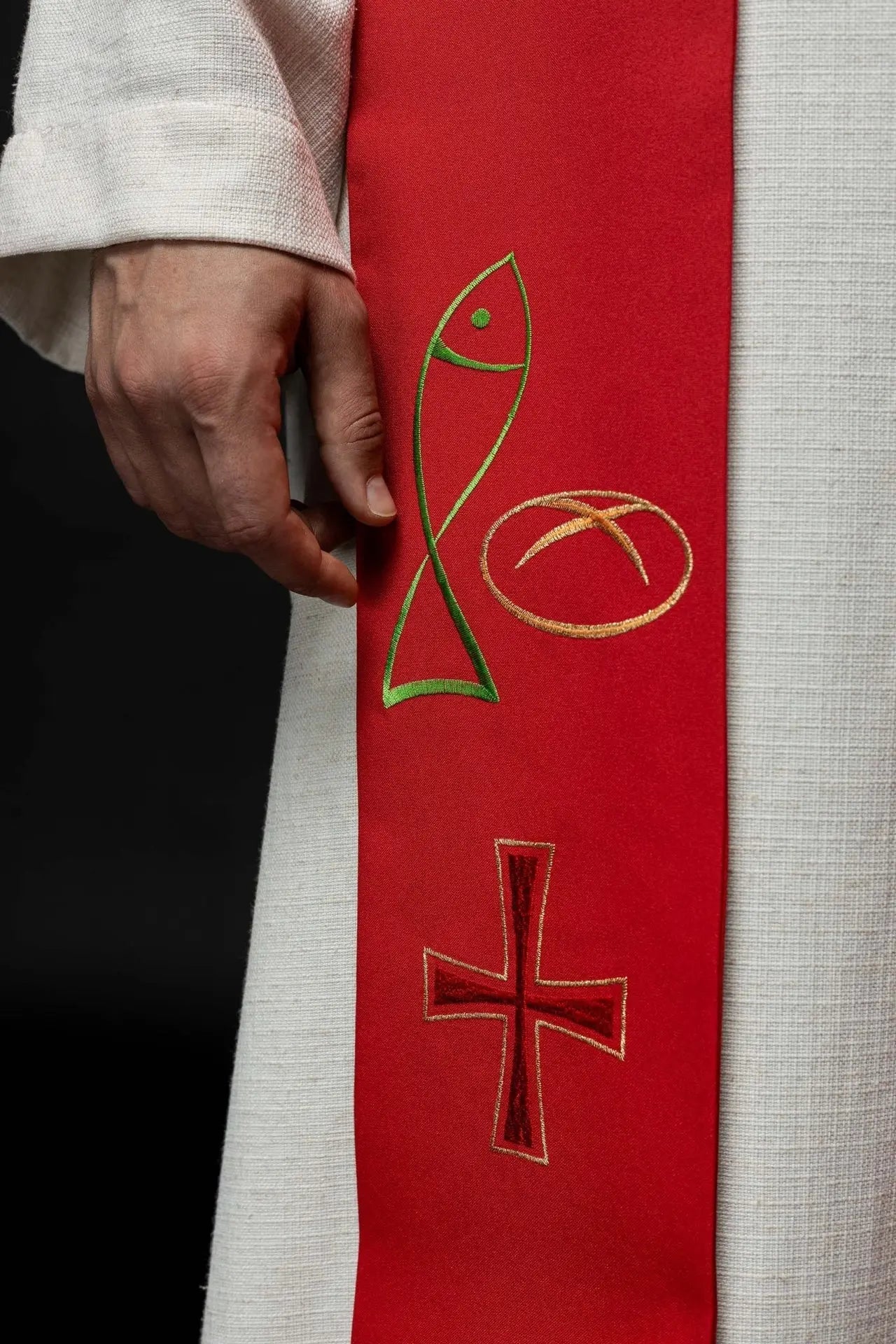 Red embroidered priest's stole with Fish Bread Cross motif