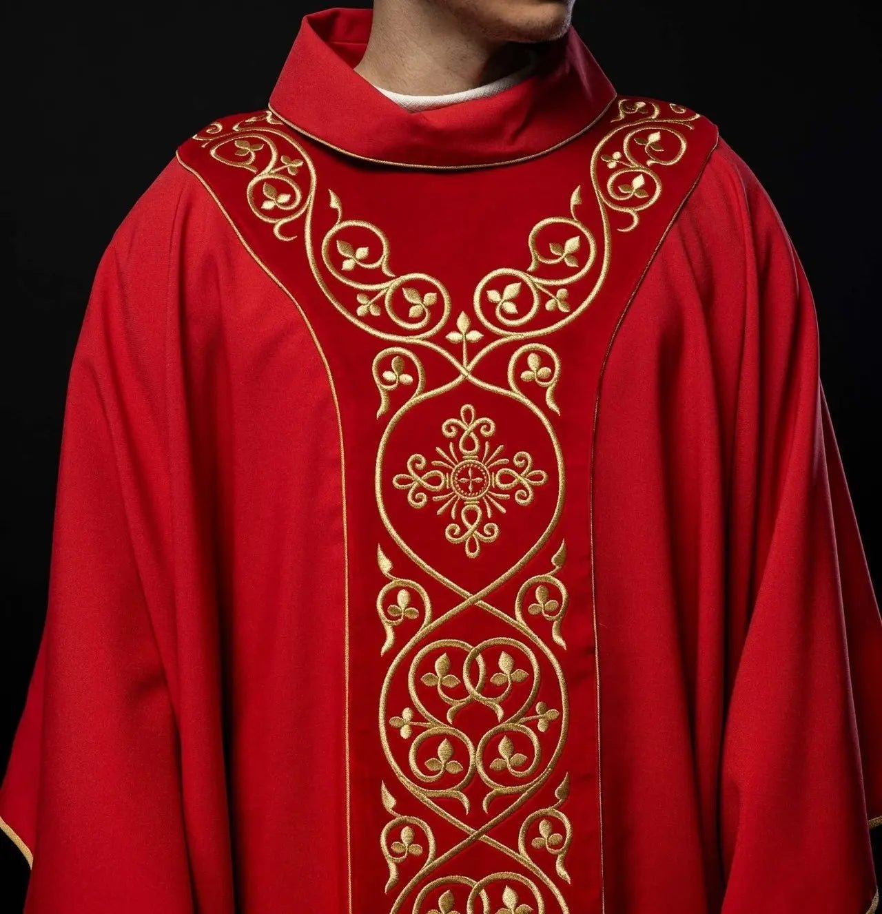 Red liturgical chasuble decorated with embroidery on velvet