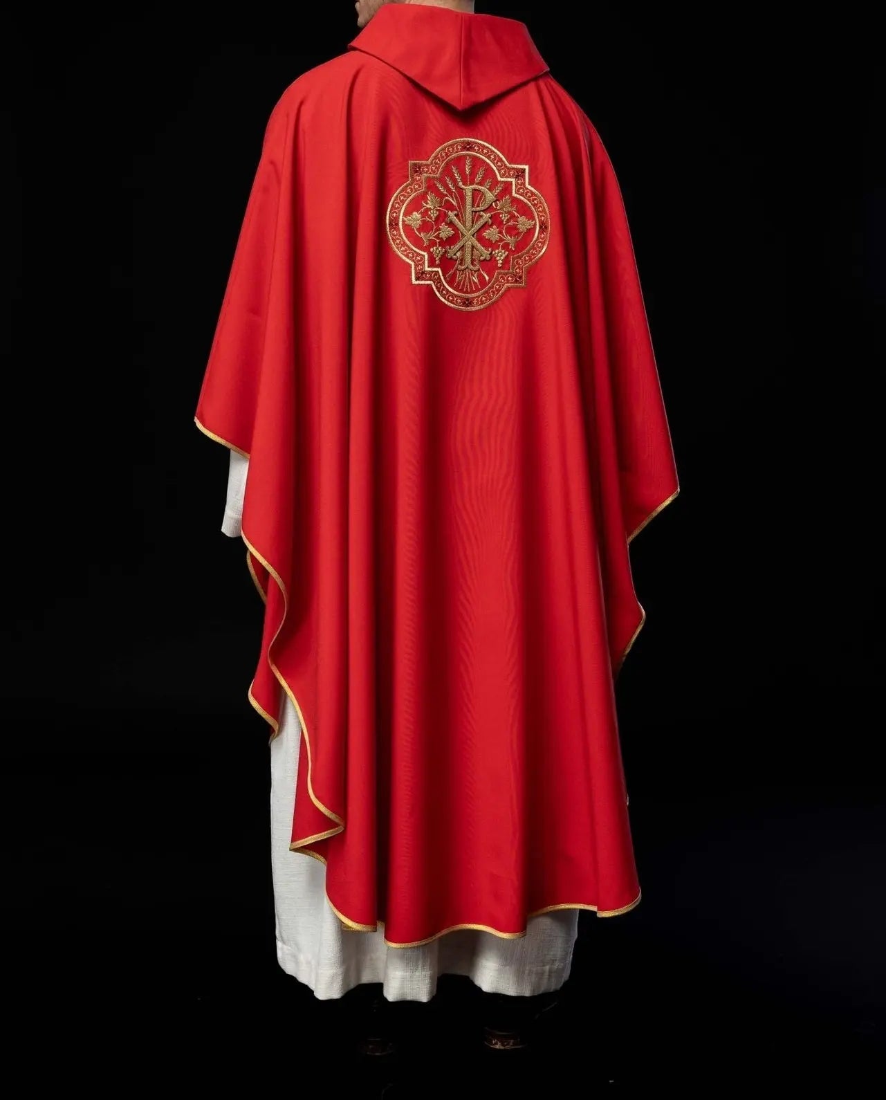 Red chasuble with IHS and PAX embroidery