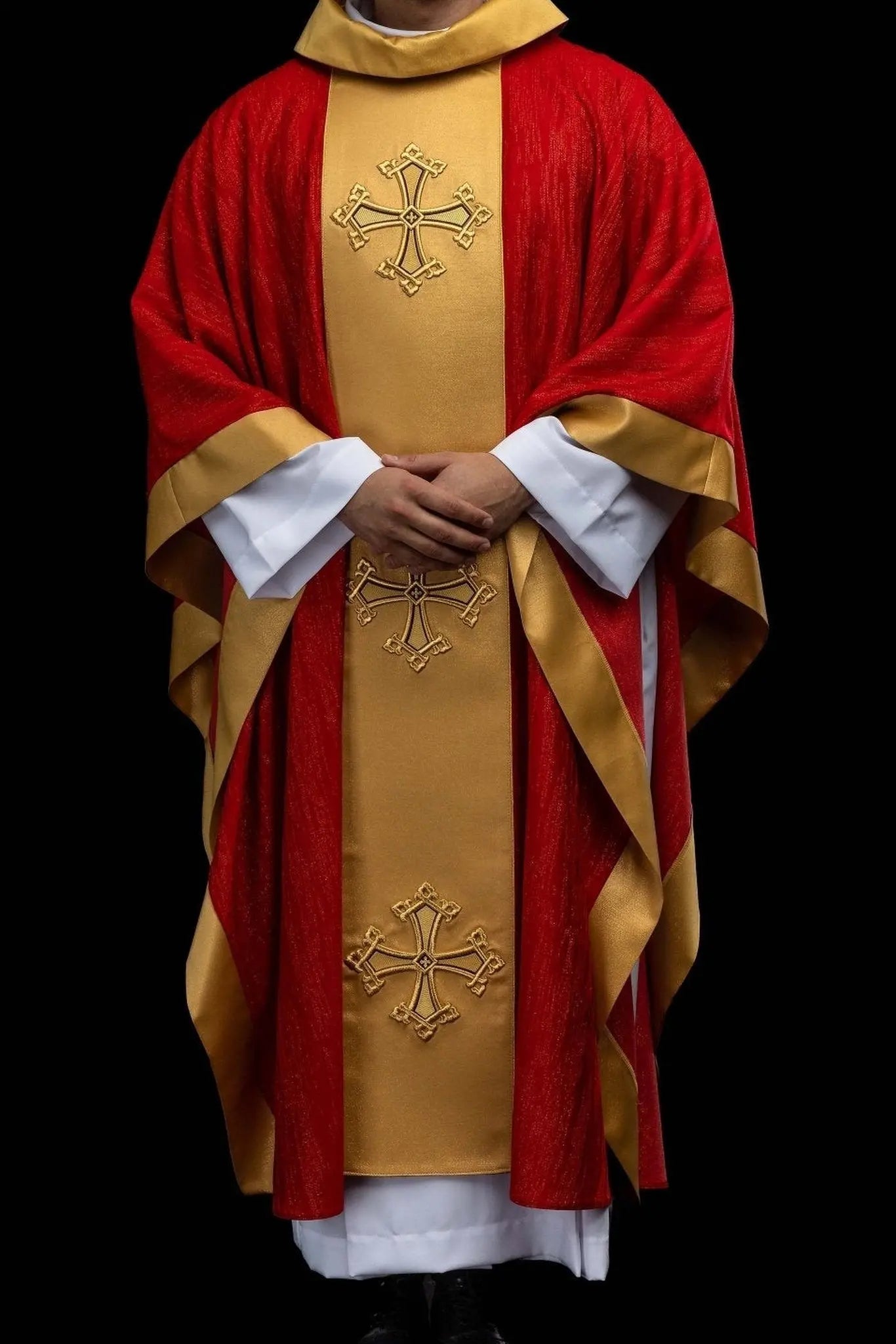 Red chasuble with embroidered cross motif and decorative gold band