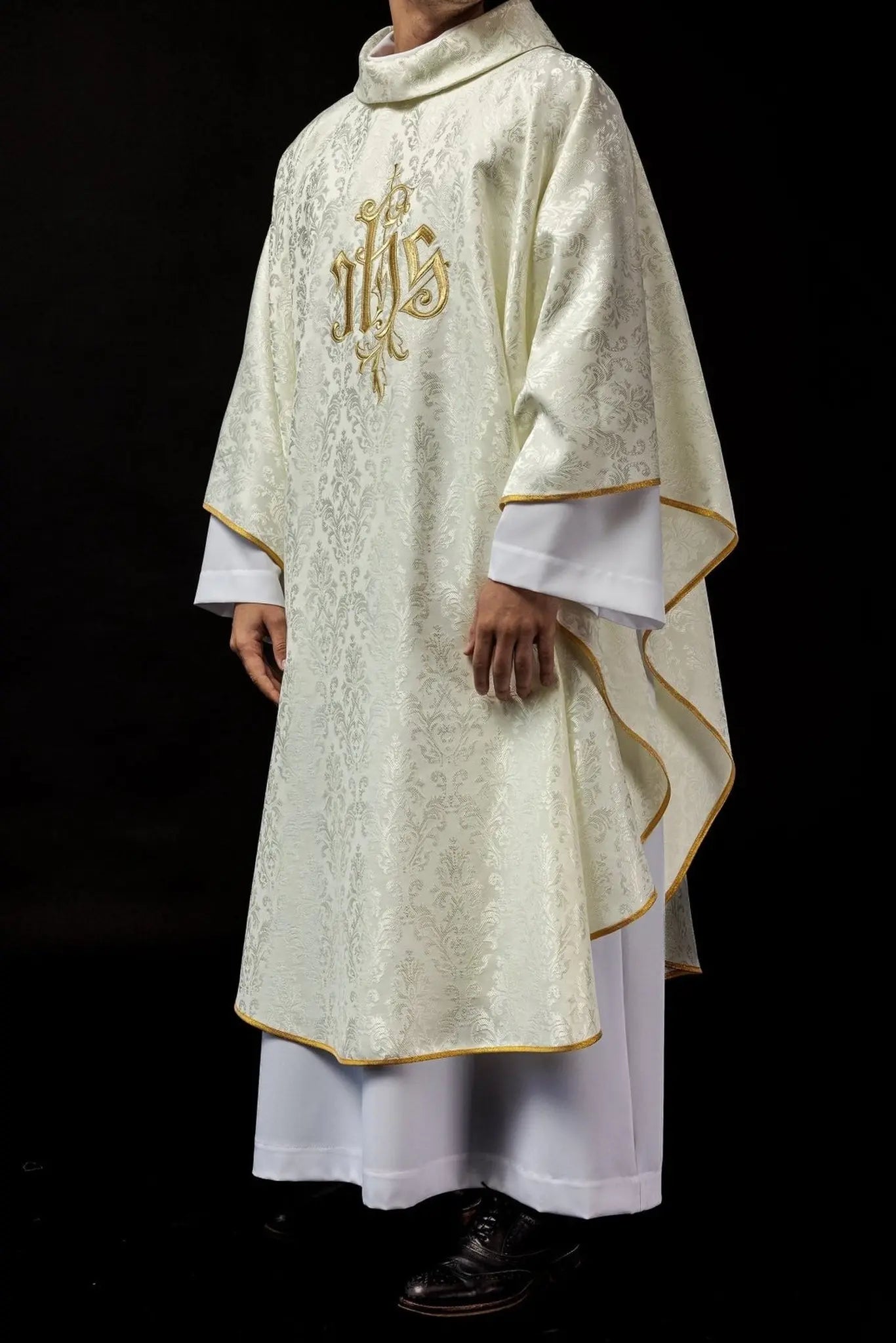 Ecru chasuble with embroidered IHS motif on decorative fabric