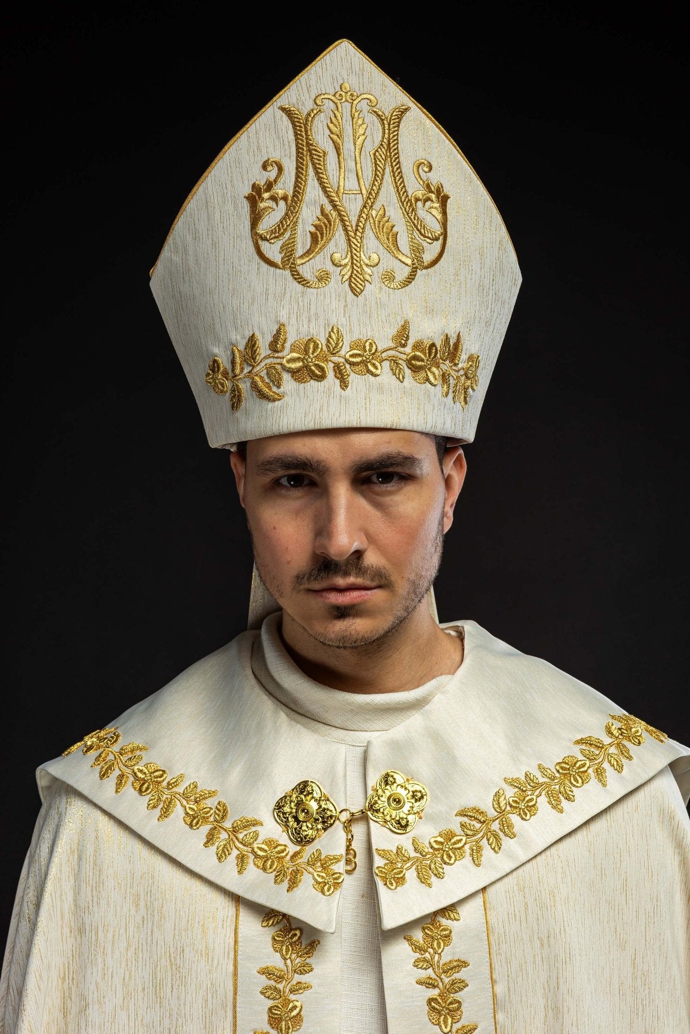 Ecru Marian mitre with rich gold embroidery and floral patterns