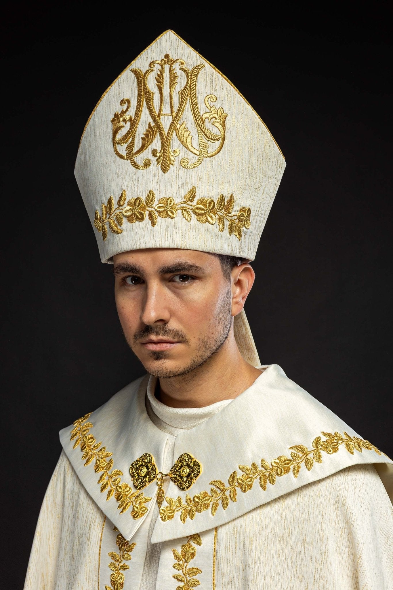Ecru Marian mitre with rich gold embroidery and floral patterns