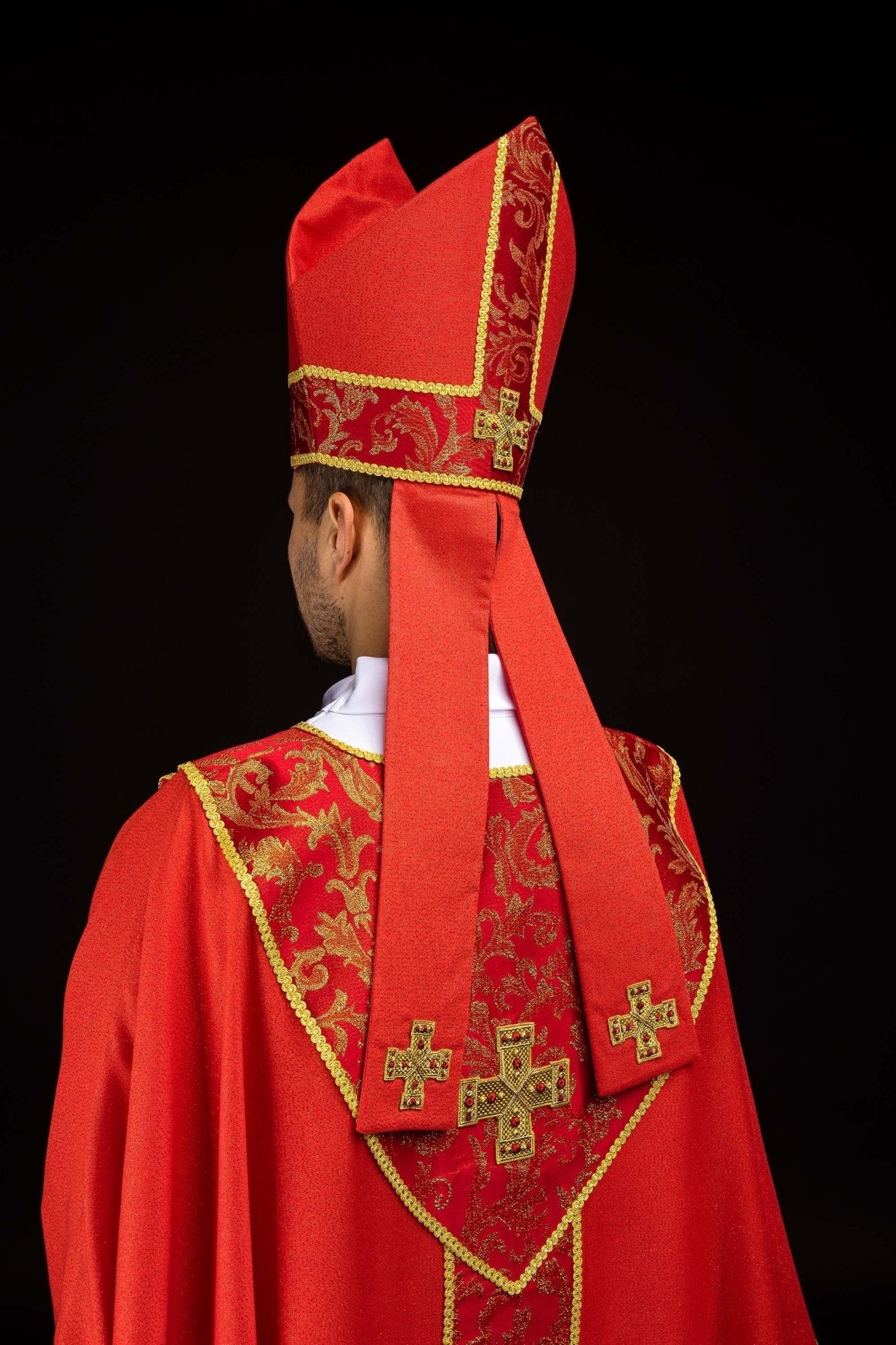 Red embroidered mitre with a cross motif and decorative jacquard fabric
