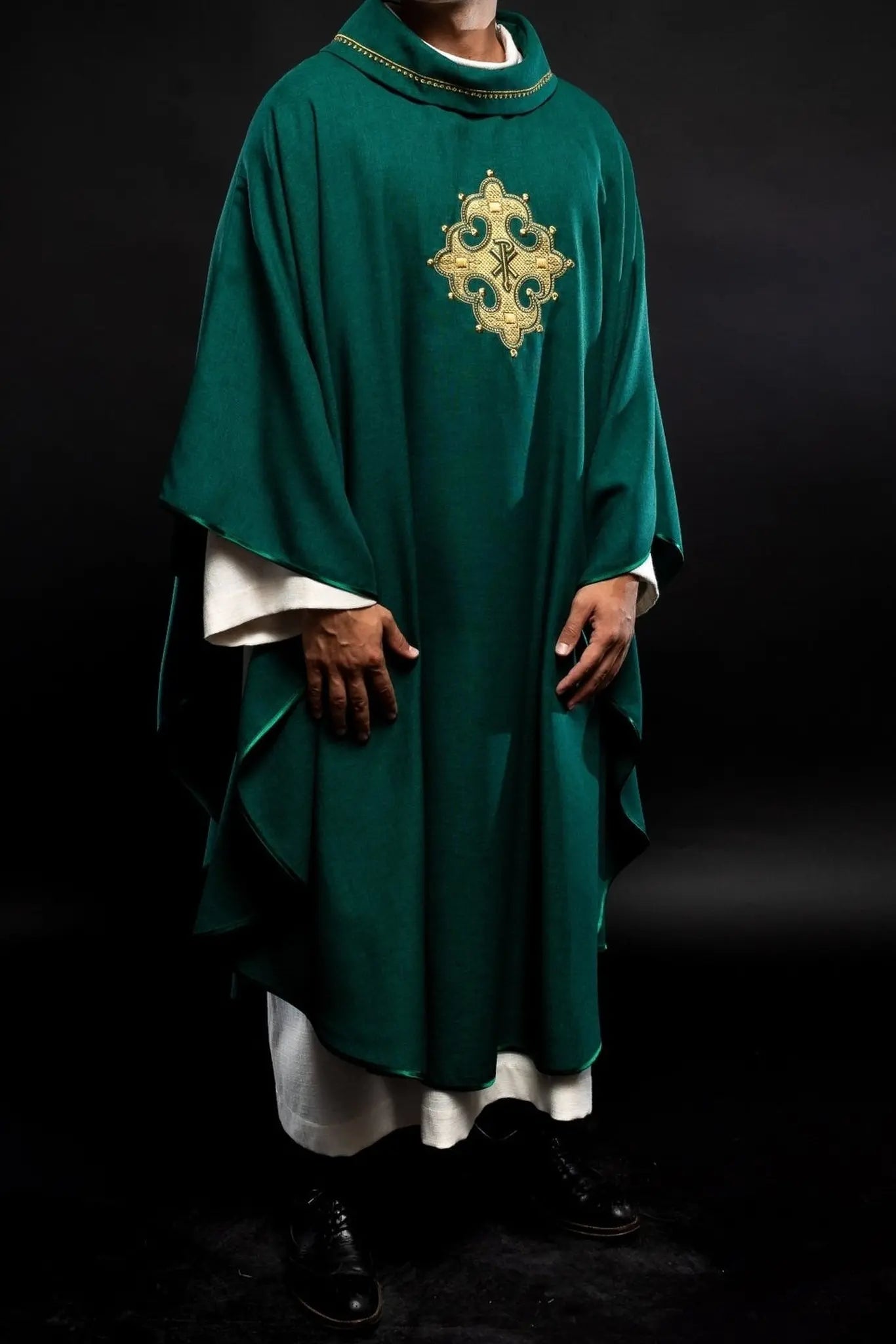 Chasuble with embroidered cross and gold trim on collar in green