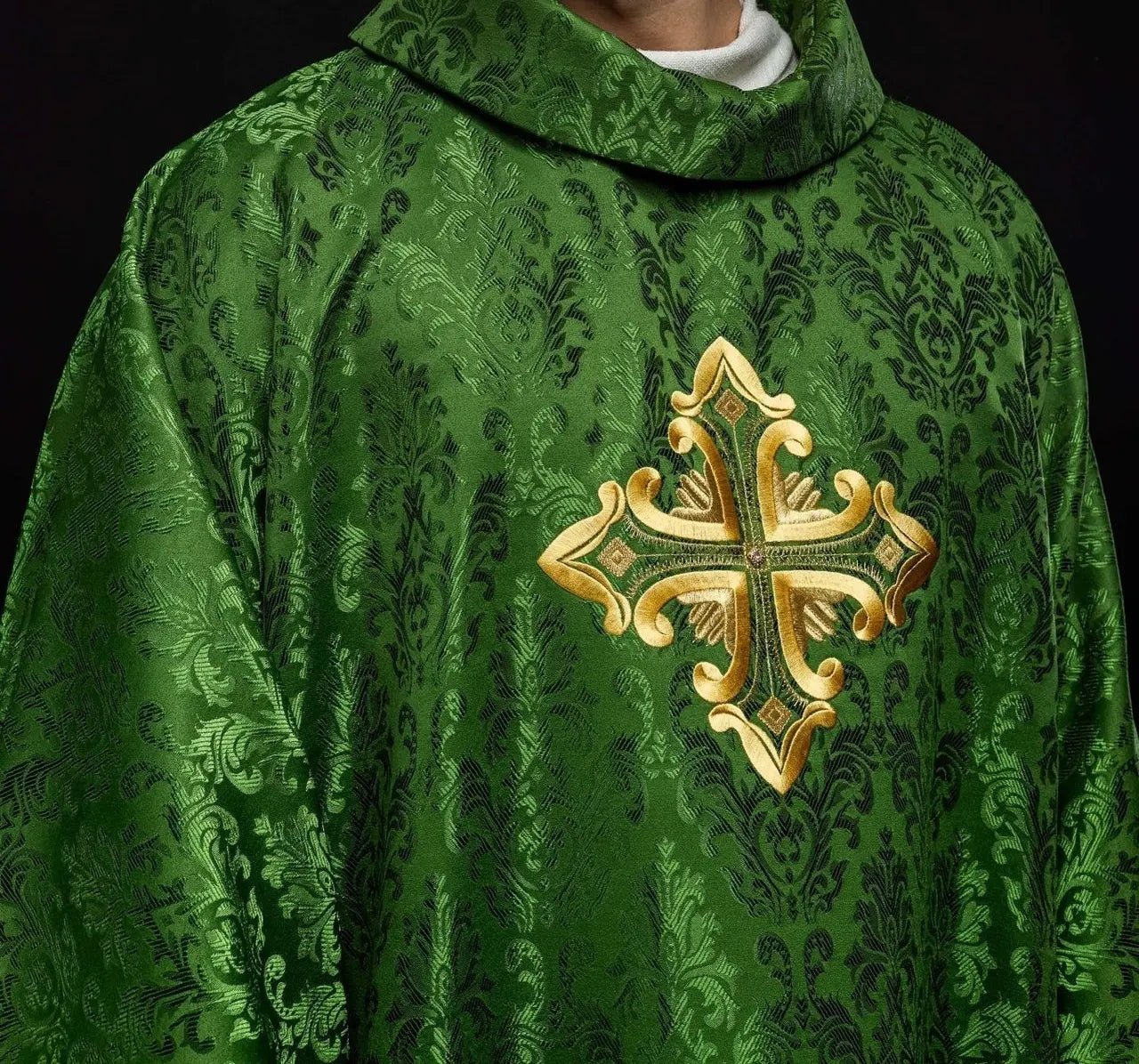 Green chasuble with cross sewn from patterned fabric