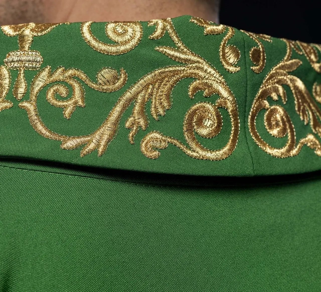 Green chasuble with gold IHS embroidery and decorative trim