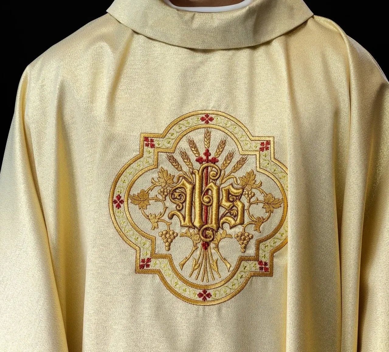 Gold chasuble with IHS and PAX embroidery